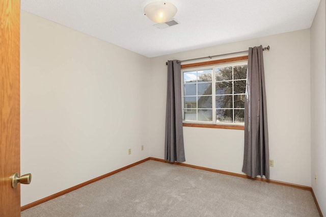 view of carpeted spare room