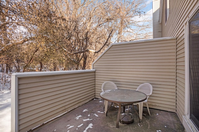 view of patio featuring a balcony