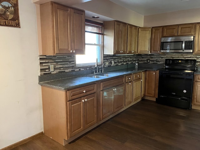 kitchen with dark wood-type flooring, decorative backsplash, black electric range, and sink