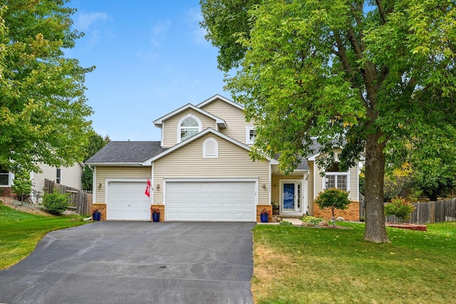 front facade with a front lawn and a garage