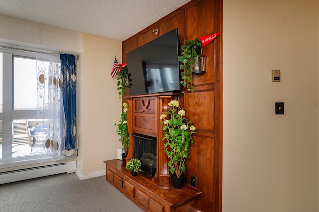 living room with light carpet, a textured ceiling, and a baseboard radiator