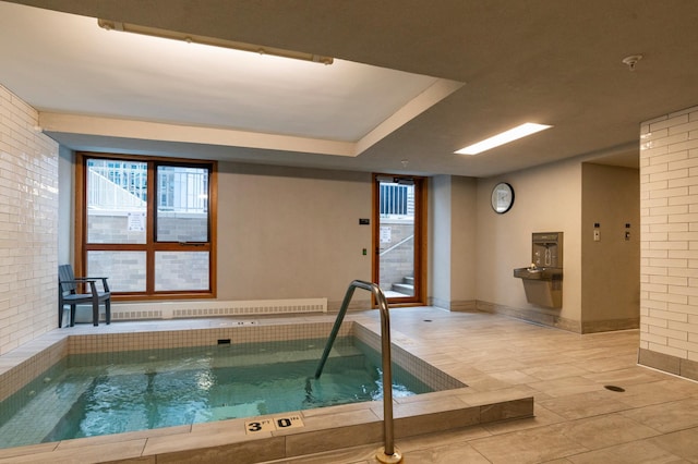 view of swimming pool featuring an indoor in ground hot tub