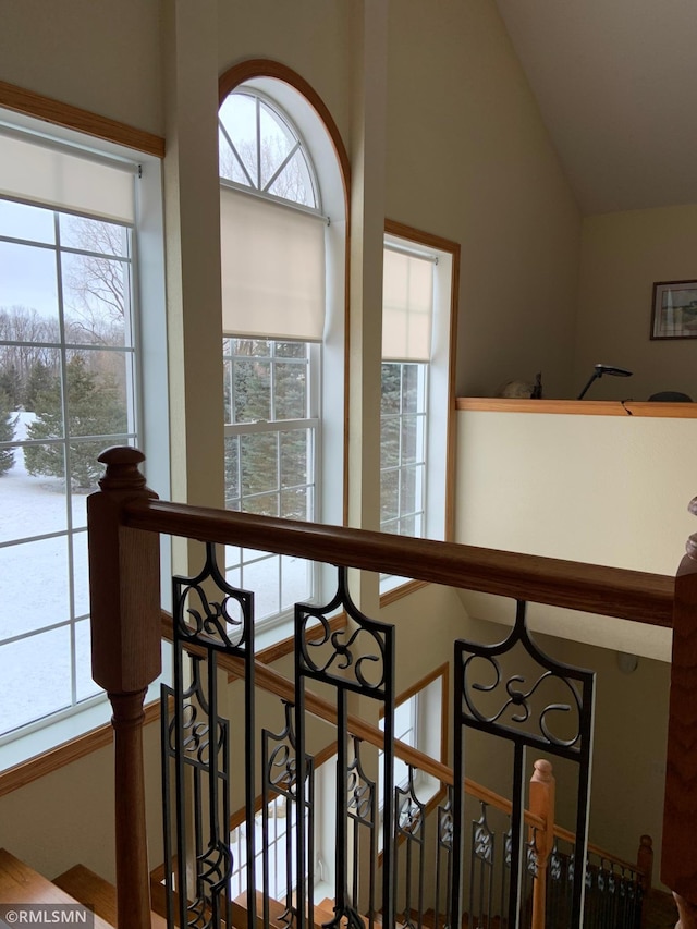 stairway with lofted ceiling