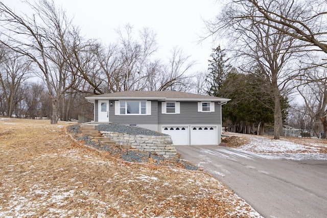 view of snow covered exterior with a garage