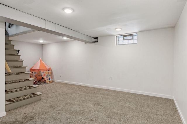 basement with carpet flooring