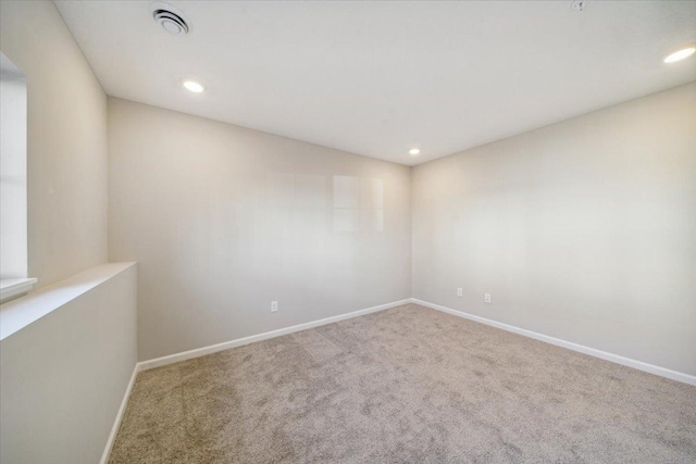 unfurnished room featuring carpet flooring