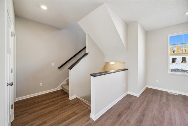 stairway featuring hardwood / wood-style floors