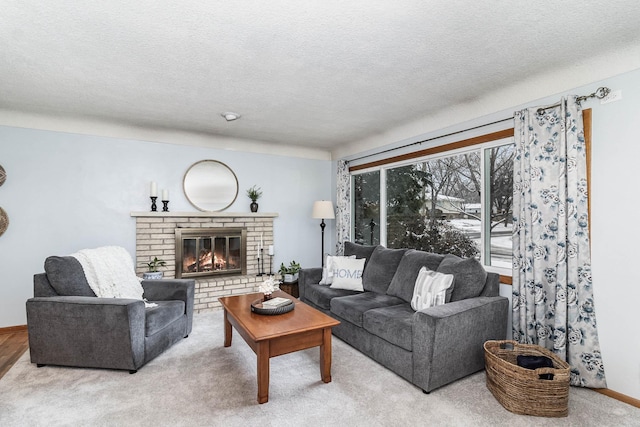 carpeted living room with a textured ceiling and a brick fireplace