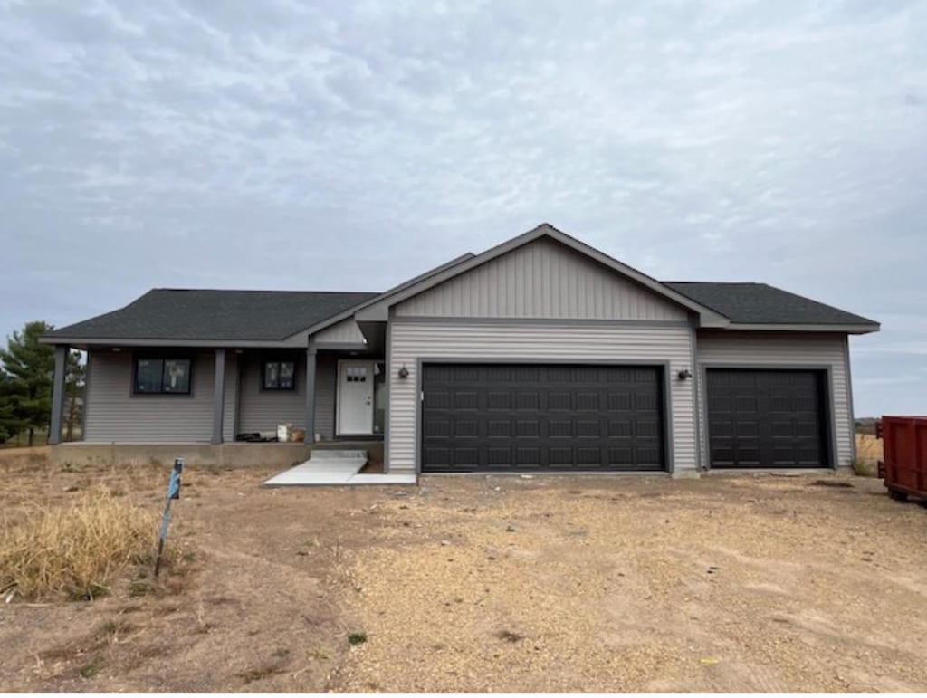 ranch-style home featuring a garage