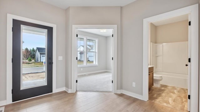 foyer with light wood-type flooring