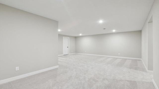 empty room featuring light carpet