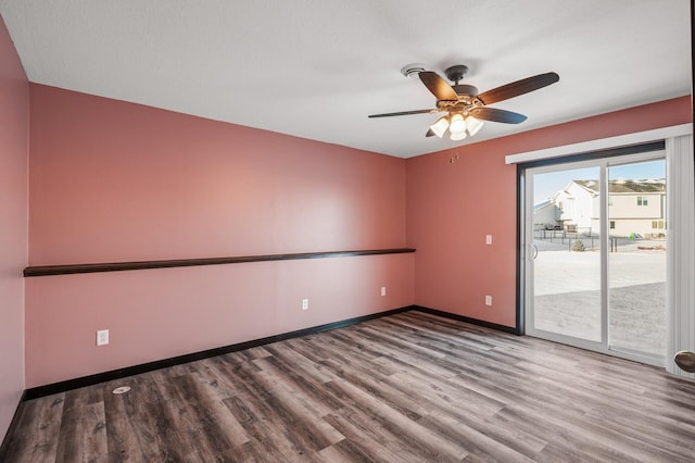 spare room with ceiling fan and hardwood / wood-style floors