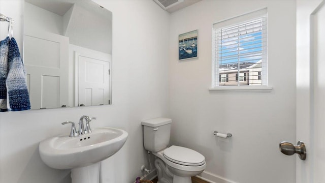 bathroom featuring sink and toilet