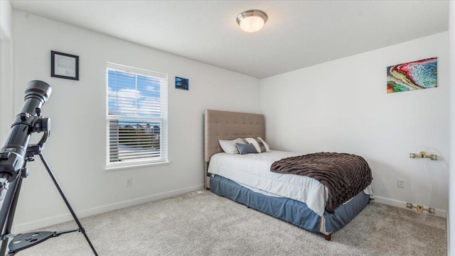 bedroom with light colored carpet