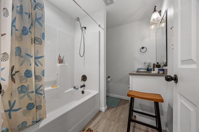 bathroom featuring shower / bathtub combination with curtain, wood-type flooring, and vanity