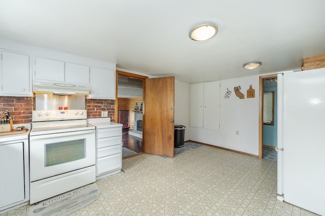 kitchen with white cabinets and white appliances