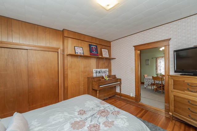 bedroom with hardwood / wood-style flooring