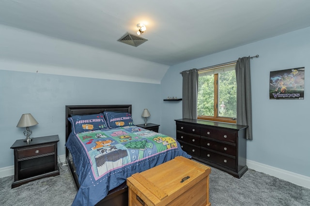 bedroom with carpet and lofted ceiling