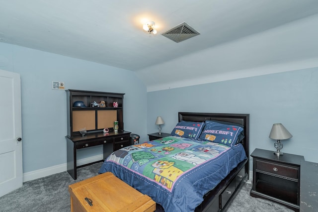 carpeted bedroom featuring lofted ceiling