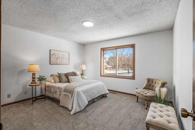 carpeted bedroom with a textured ceiling