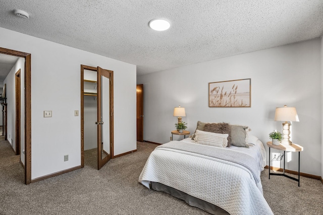 carpeted bedroom with a textured ceiling