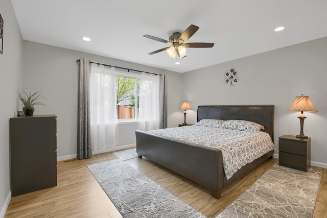 bedroom featuring ceiling fan and light wood-type flooring