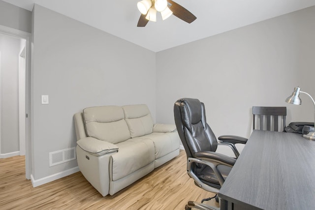 office space with ceiling fan and light hardwood / wood-style floors