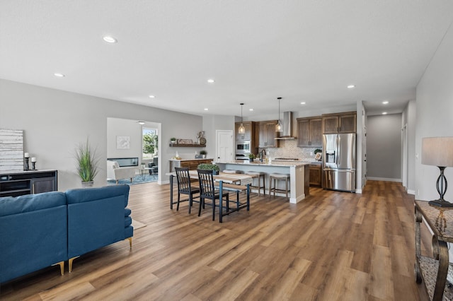 living room with sink and dark hardwood / wood-style floors