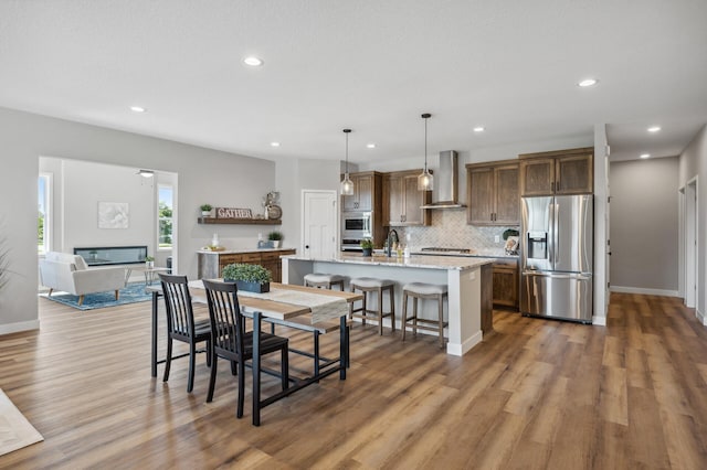 dining room with dark hardwood / wood-style flooring and sink