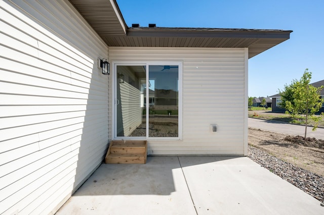 doorway to property with a patio