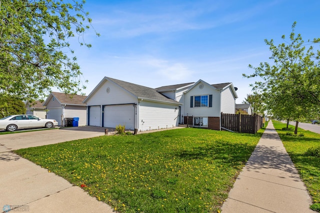 view of front of house featuring a front lawn and a garage