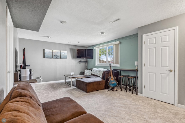 bedroom with a textured ceiling and carpet