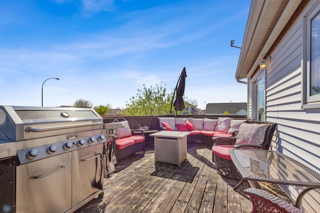 deck with grilling area and outdoor lounge area