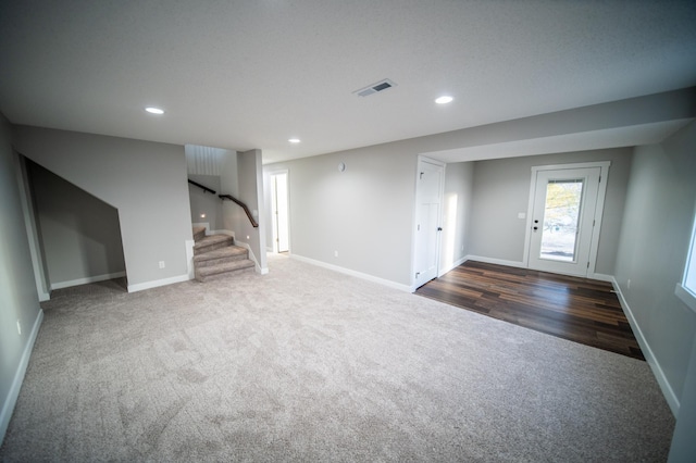 interior space featuring dark colored carpet