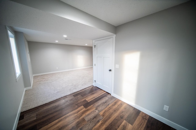 unfurnished room featuring dark hardwood / wood-style floors