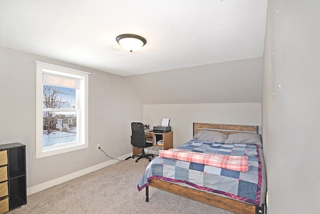 bedroom featuring vaulted ceiling and carpet flooring