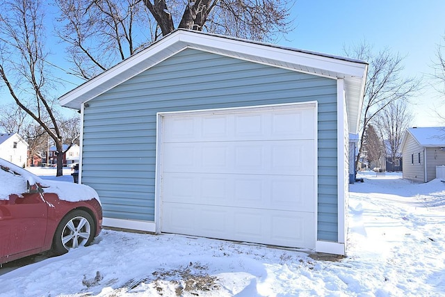 view of snow covered garage