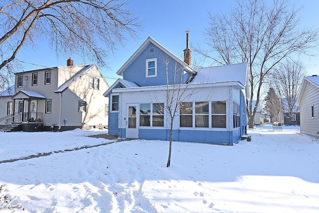 view of snow covered house