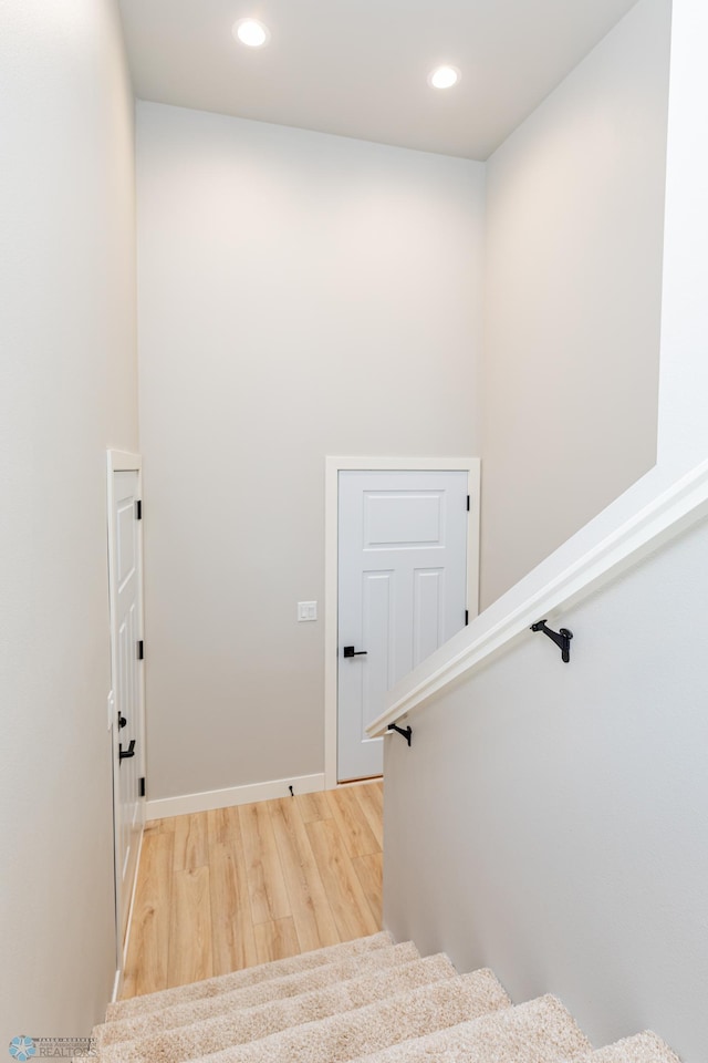 staircase featuring hardwood / wood-style floors