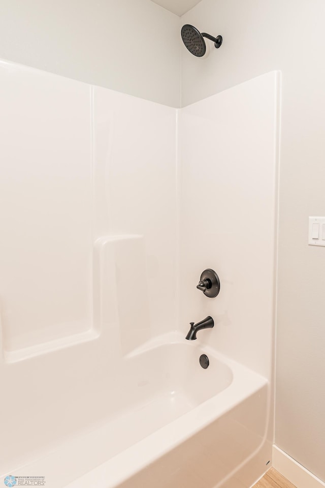 bathroom featuring washtub / shower combination