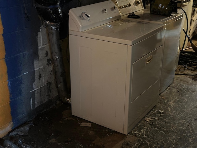 laundry room featuring separate washer and dryer