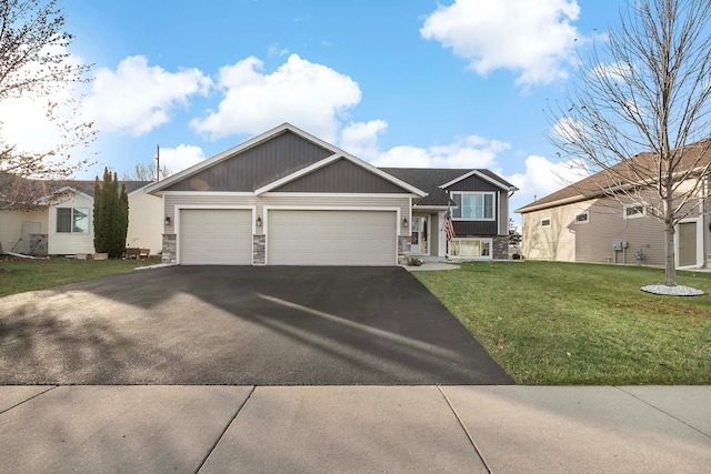 view of front facade with a front lawn and a garage