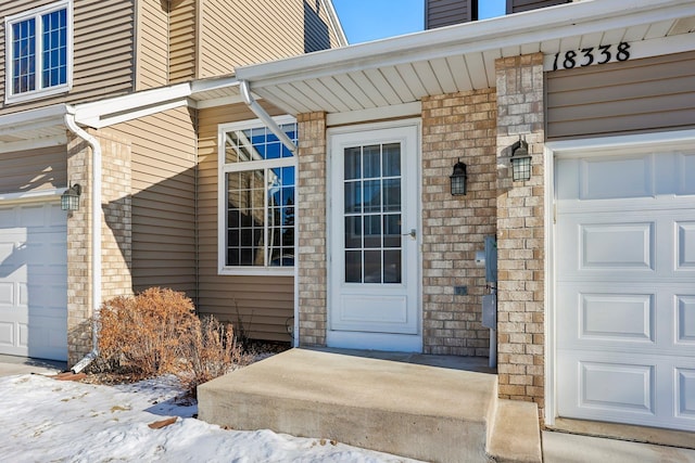 view of snow covered property entrance