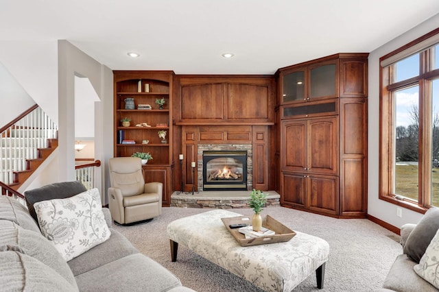 living room with baseboards, carpet, stairway, recessed lighting, and a fireplace