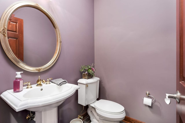 bathroom featuring toilet and a sink