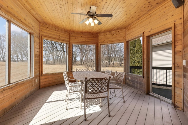 sunroom / solarium with wooden ceiling and ceiling fan