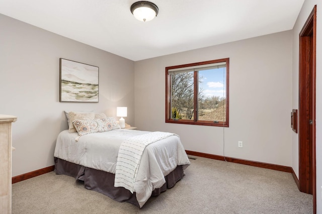 carpeted bedroom with baseboards