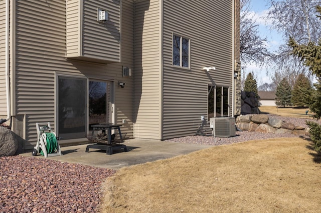 back of property featuring a patio and cooling unit