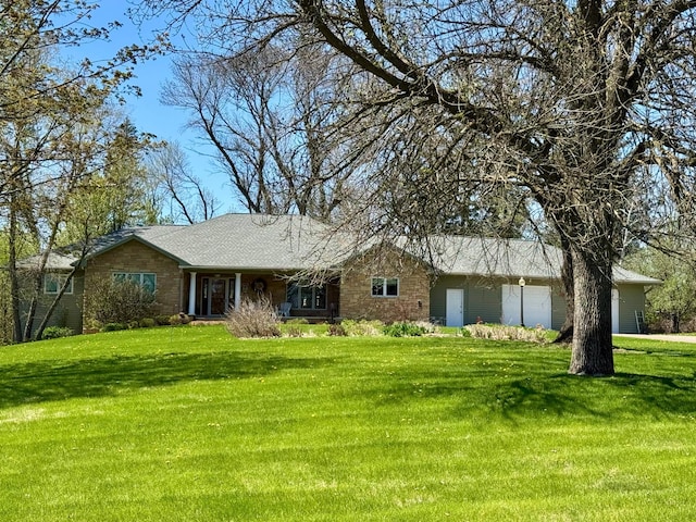 12326 Falk Trl, Northfield, MN 55057 - single story home with a front lawn, stone siding, and a garage