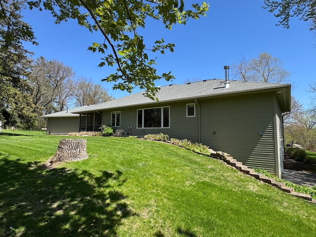 12326 Falk Trl, Northfield, MN 55057 - back of house featuring a yard and a sunroom